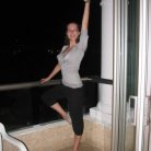Kelly always has dance on the mind, here she is posing on a hotel balcony.