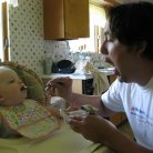 Eric feeding his nephew