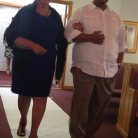 Mike walking his mom down the aisle