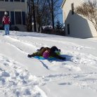 our favorite thing to do in the winter, sledding down our huge hill in the front yard!